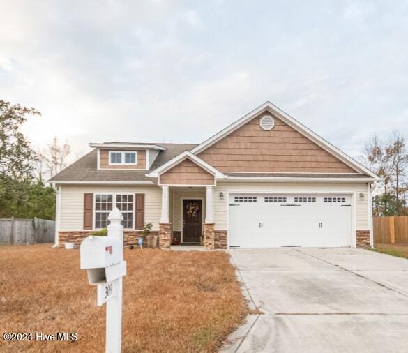 craftsman inspired home with a garage