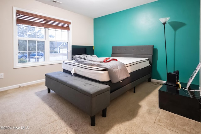 bedroom with light colored carpet