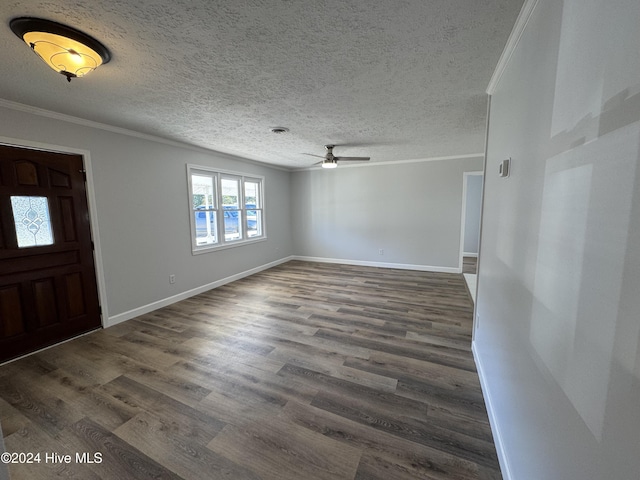 entryway featuring dark hardwood / wood-style floors, ceiling fan, and crown molding