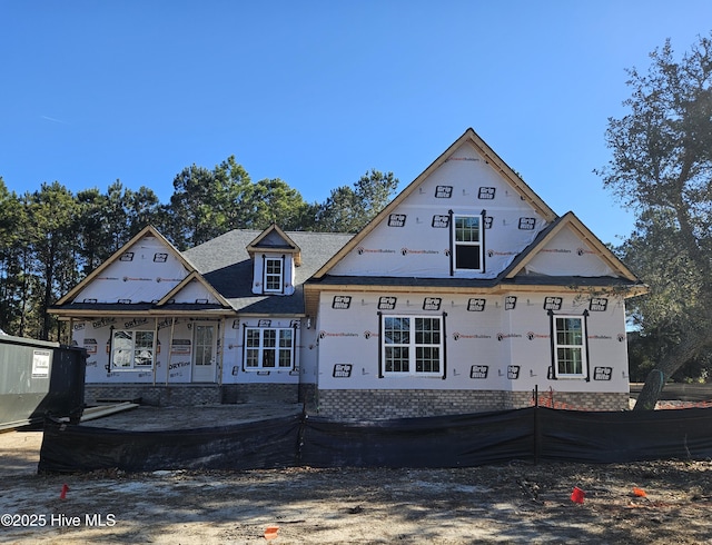 property in mid-construction featuring covered porch