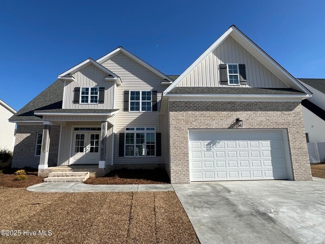 craftsman-style house with a front lawn and a garage