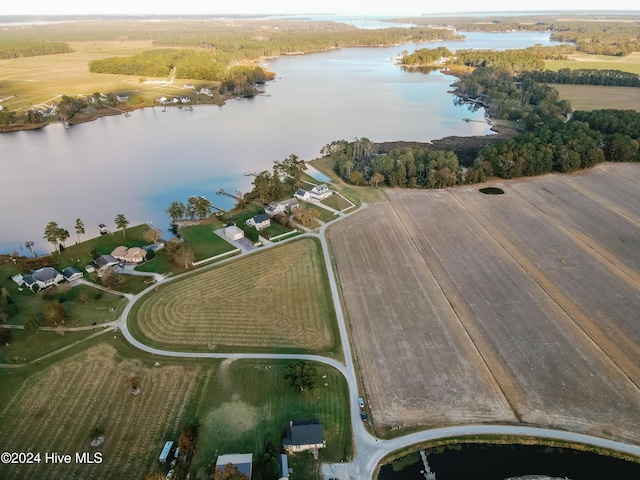 drone / aerial view with a rural view and a water view