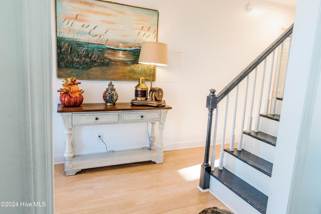 stairway with wood-type flooring