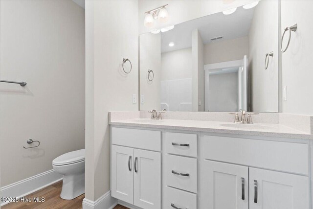 kitchen with white cabinetry, sink, hanging light fixtures, stainless steel dishwasher, and a center island with sink