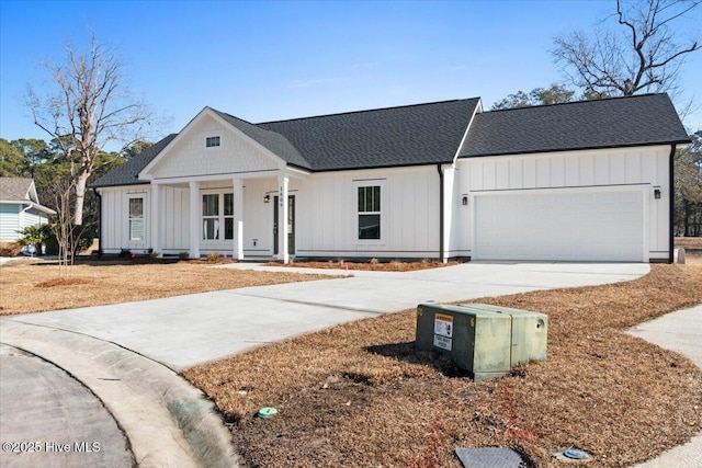 modern inspired farmhouse featuring a garage