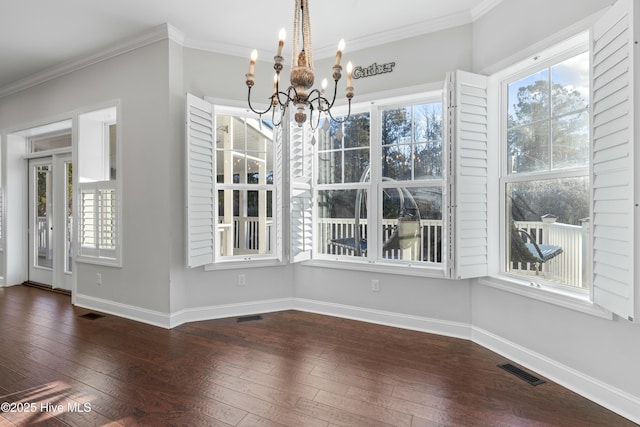 unfurnished dining area with visible vents, baseboards, dark wood-type flooring, and ornamental molding