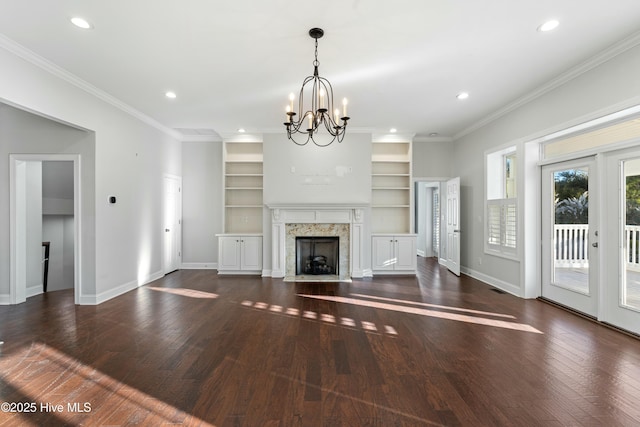 unfurnished living room featuring hardwood / wood-style flooring, baseboards, a fireplace, and ornamental molding