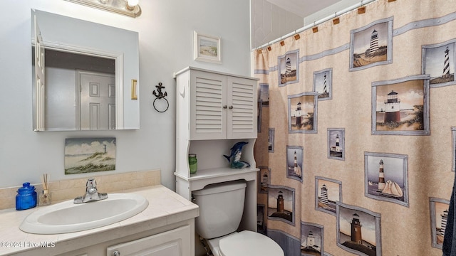 bathroom with toilet and vanity