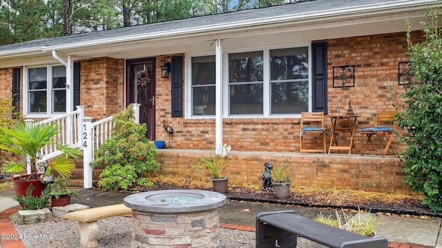 property entrance featuring brick siding