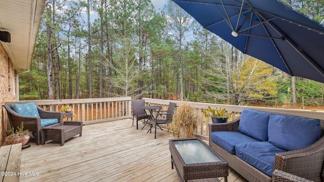 wooden deck with an outdoor hangout area