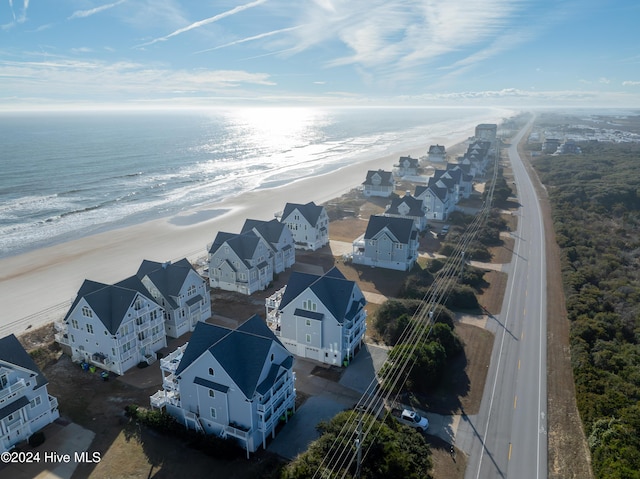 bird's eye view featuring a beach view and a water view