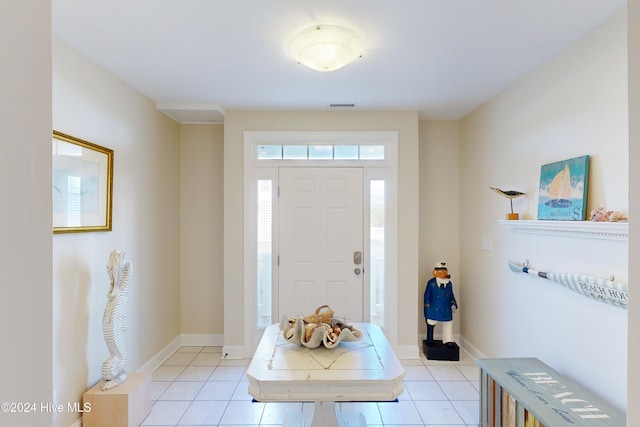 entryway featuring light tile patterned flooring, visible vents, and baseboards