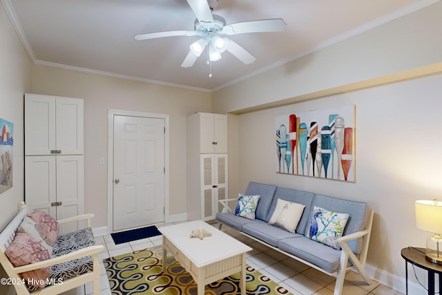 living area with light tile patterned floors, ornamental molding, a ceiling fan, and baseboards