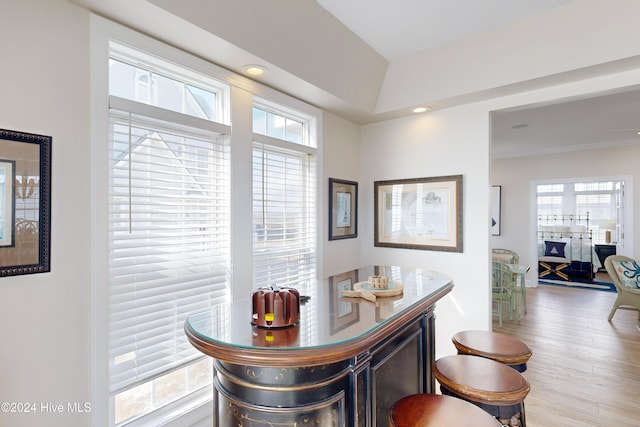 bar with recessed lighting and wood finished floors