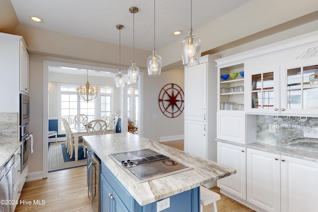 kitchen with blue cabinetry, light wood-type flooring, appliances with stainless steel finishes, and white cabinets