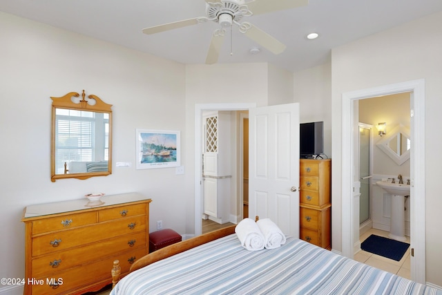 bedroom with a sink, tile patterned floors, connected bathroom, and recessed lighting