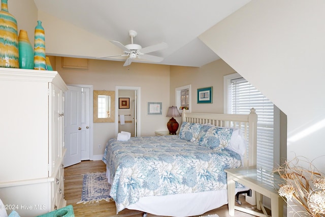 bedroom featuring ceiling fan, wood finished floors, and lofted ceiling