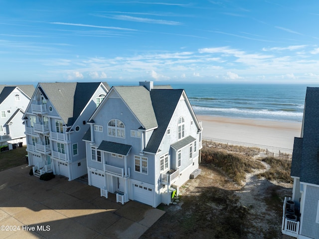 aerial view featuring a water view and a view of the beach