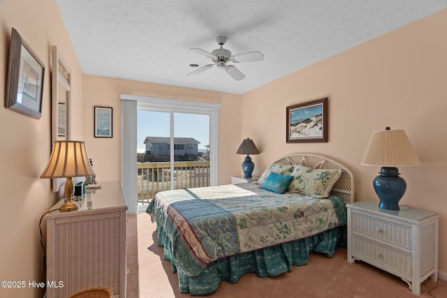 carpeted bedroom with a textured ceiling, access to outside, and ceiling fan