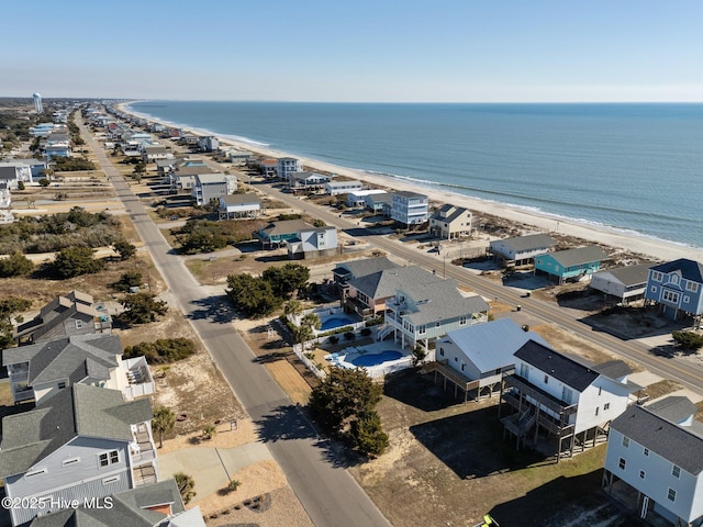 bird's eye view with a view of the beach and a water view