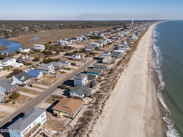 aerial view with a water view and a view of the beach