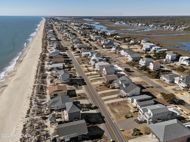 aerial view with a water view and a view of the beach