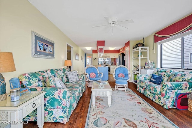 living room with hardwood / wood-style floors and ceiling fan