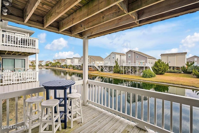 wooden deck with a water view