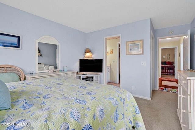 bedroom featuring light carpet