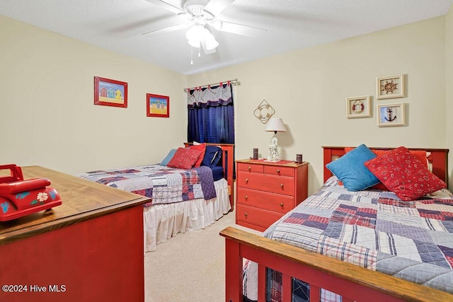 bedroom with ceiling fan and carpet floors