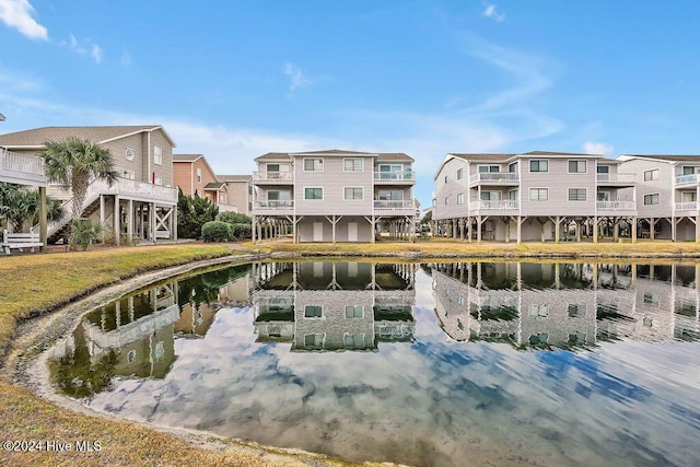 view of home's community with a water view