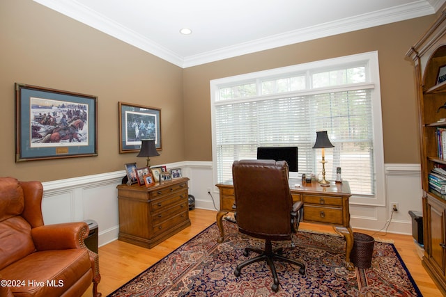 home office featuring light hardwood / wood-style floors and ornamental molding