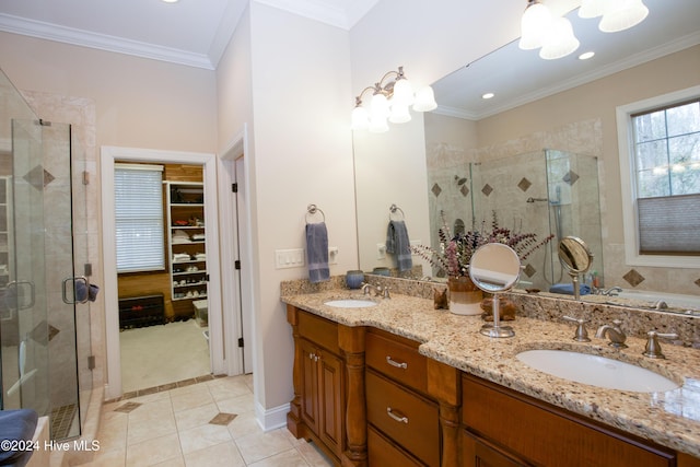 bathroom featuring tile patterned floors, vanity, ornamental molding, and walk in shower