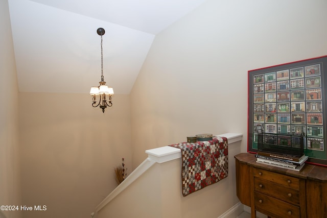 staircase featuring vaulted ceiling