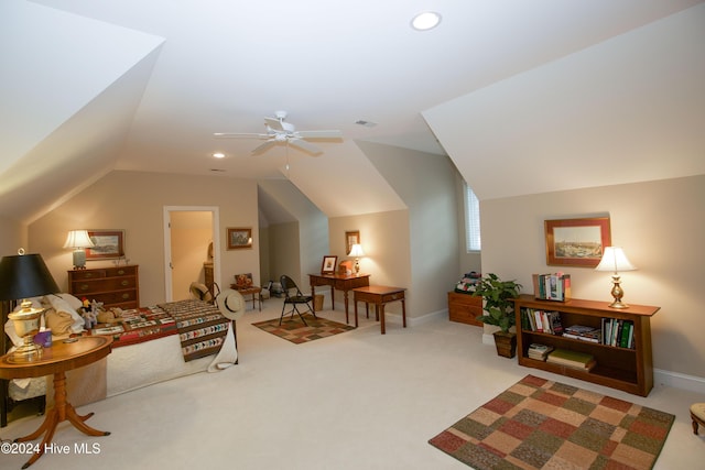 interior space featuring carpet floors, vaulted ceiling, and ceiling fan