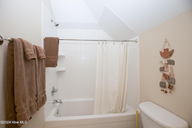 bathroom featuring toilet and shower / bath combo with shower curtain