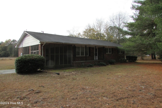 view of front of property with a sunroom