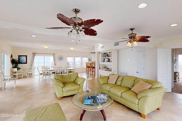 living room featuring ceiling fan and light tile patterned floors