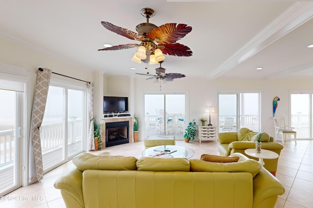 tiled living room with crown molding and ceiling fan