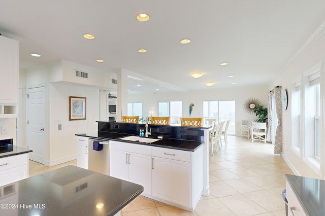 kitchen with dishwasher, plenty of natural light, and sink