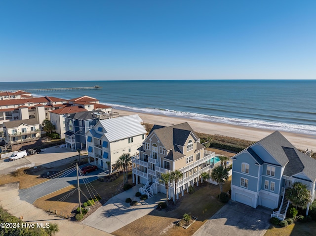 aerial view with a water view and a view of the beach