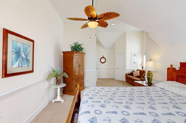 bedroom with ceiling fan, light carpet, and high vaulted ceiling