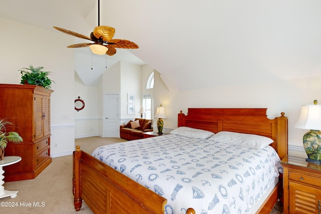 carpeted bedroom featuring ceiling fan and lofted ceiling