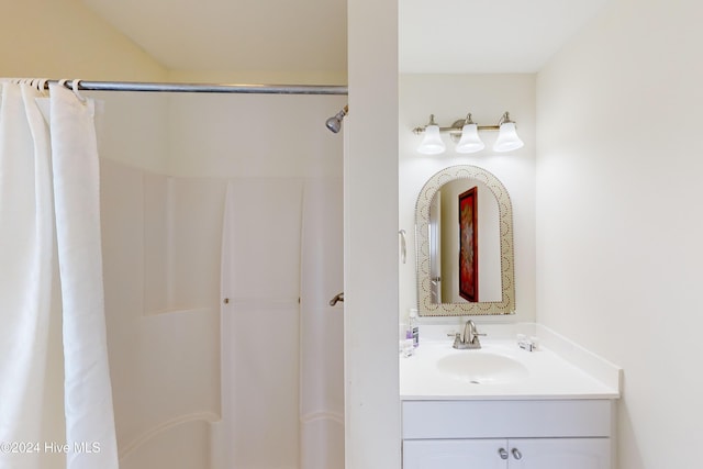 bathroom with vanity and curtained shower