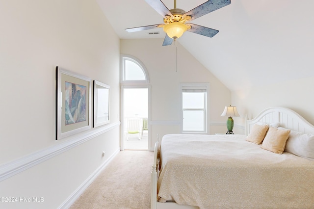 carpeted bedroom featuring vaulted ceiling and ceiling fan