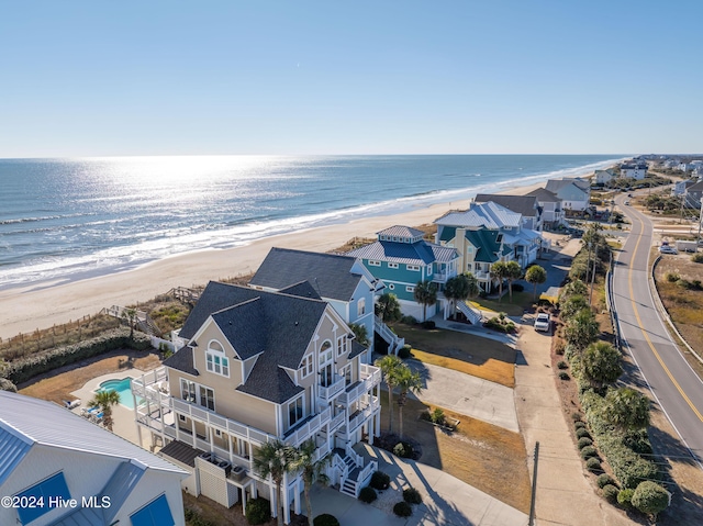 bird's eye view featuring a water view and a view of the beach