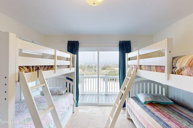 carpeted bedroom featuring access to outside