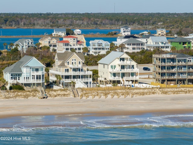 bird's eye view with a beach view and a water view