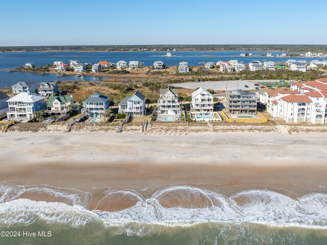 bird's eye view with a beach view and a water view