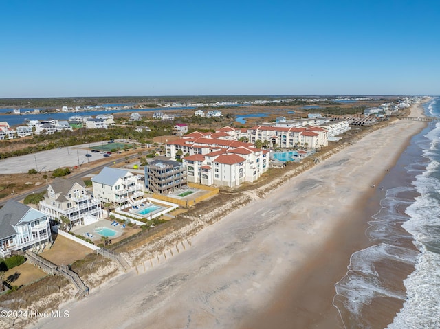 bird's eye view featuring a beach view and a water view